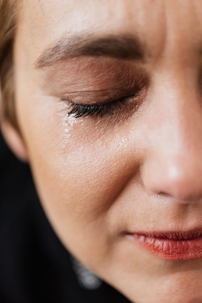 pexels-photo-4471316-1 Closeup of crop sad adult lady with natural makeup having problems and crying alone